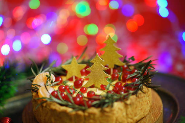 istock Christmas pie on lights background. Bakery with berries. New year mood. 1356010395
