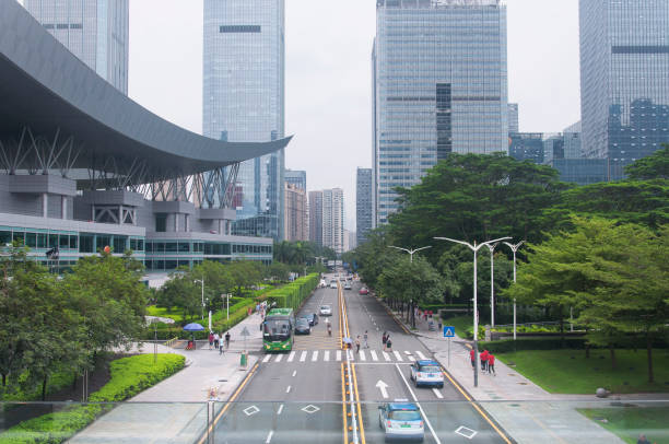 shenzhen, china.  August 19, 2018. People walking around the shopping park district near the civic center in shenzhen china on an overcast day.