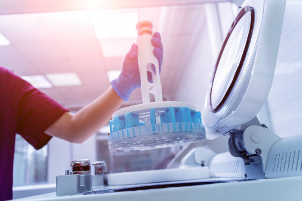 istock Laboratory assistant works with microwave hybrid tissue processor at the modern laboratory. 1356012905
