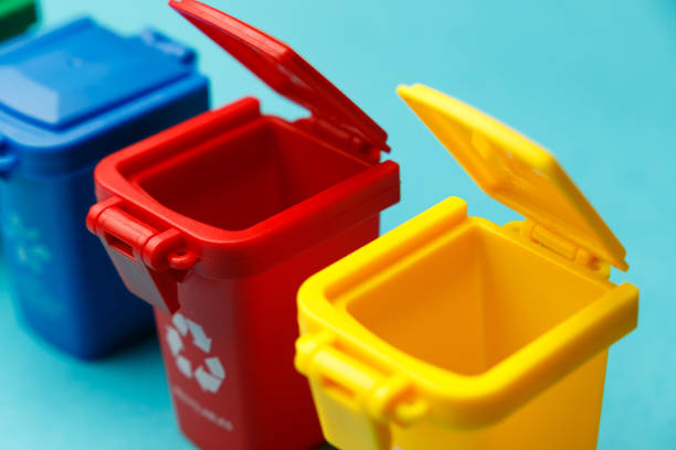 istock Dumpsters close-up. Container for disposal garbage waste and save environment. Yellow, red, blue and green dustbins for recycle. The concept of ecology. Separate garbage collection 1356017056