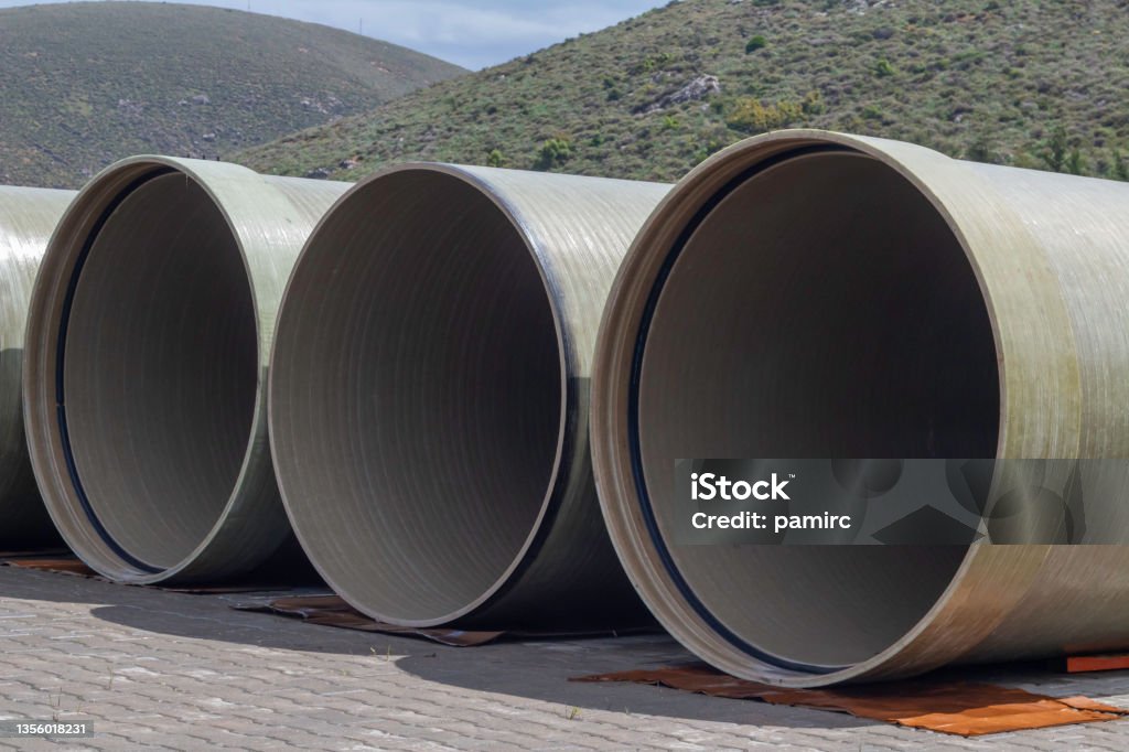 rubber gasketed grp (frp) pipes are kept at the shipping site Pipe - Tube Stock Photo