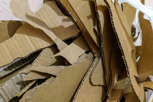 istock Texture. Pieces of cardboard of yellow color from which different objects were cut. 1356019364