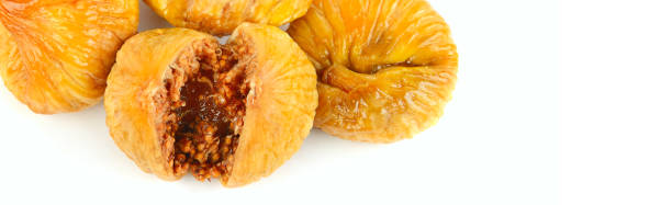 istock Dried figs isolated on white background. Wide photo. Free space for text. 1356019671
