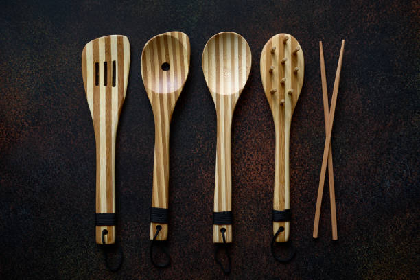 istock Bamboo wooden cooking utensils on dark background closeup 1356021620