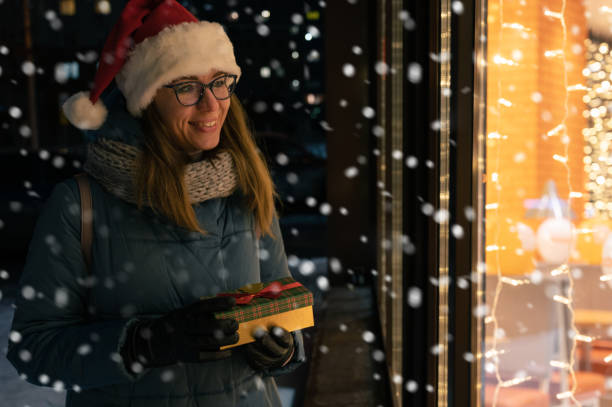 istock Pretty Woman in Santas hat 1356021979