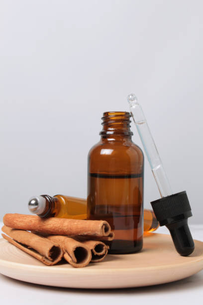 istock ground cinnamon, essential oil and cinnamon sticks cinnamon on a grey background 1356022964