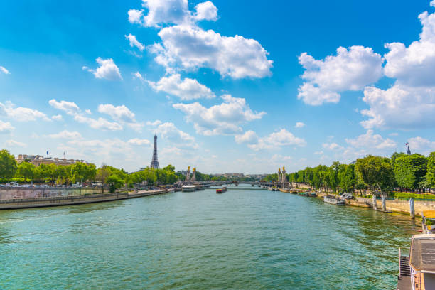 istock Cloudy sky over world famous Eiffel tower in Paris 1356022969