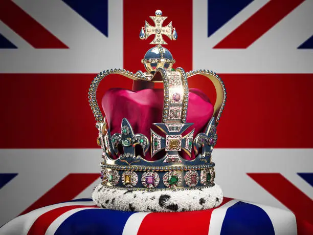 Photo of Royal imperial state crown on UK flag background. Symbols of Great Britain UK United Kingdom monarchy.