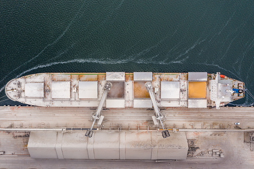 Loading the vessel with grain, corn at the seaport. View from above.