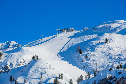 Dolomities Dolomiti Italy in wintertime beautiful alps winter mountains and ski slope Cortina d'Ampezzo Faloria skiing resort area