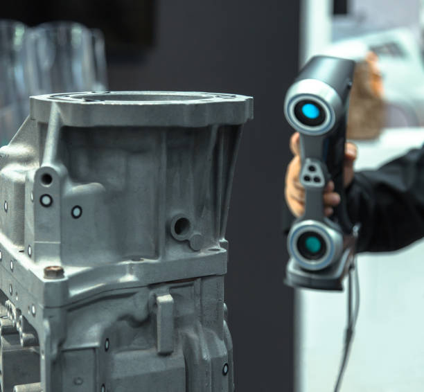istock 3D Laser Scanning. Engineer scans the part with 3D scanner. 1356026546