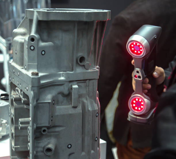istock 3D Laser Scanning. Engineer scans the part with 3D scanner. 1356026547
