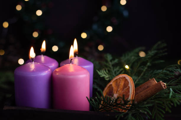 istock Four purple advent candles in Christmas eve. 1356031290