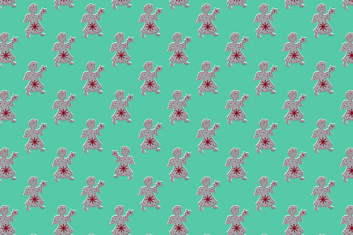 Christmas Angel - flat seamless pattern on a green background for Christmas wrapping paper concept