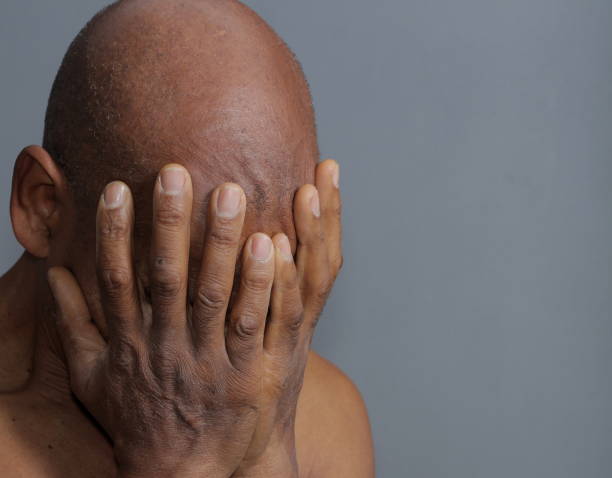 istock man praying with hands stock photo 1356034133
