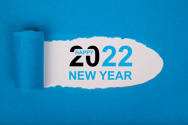istock Torn Paper With Happy New Year 2022 On White Background 1356040884