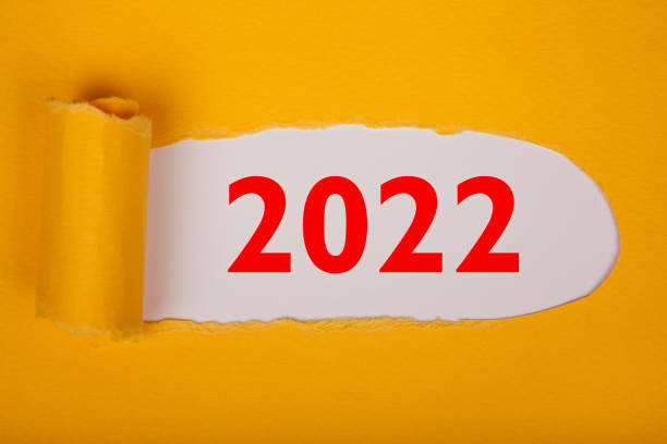 istock Torn Paper With Happy New Year 2022 On White Background 1356041563