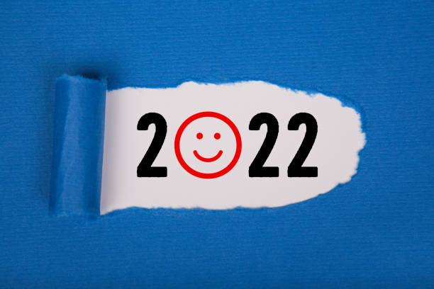 istock Torn Paper With Happy New Year 2022 On White Background 1356042031