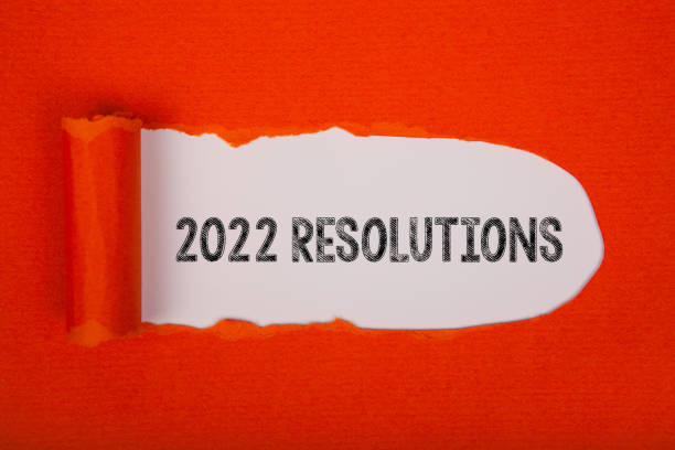 istock Torn Paper With New Year 2022 Resolutions On White Background 1356044195