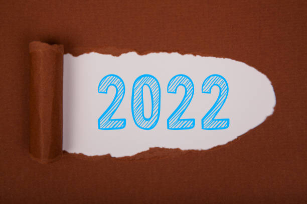 istock Torn Paper With Happy New Year 2022 On White Background 1356044255