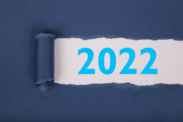 istock Torn Paper With Happy New Year 2022 On White Background 1356044388