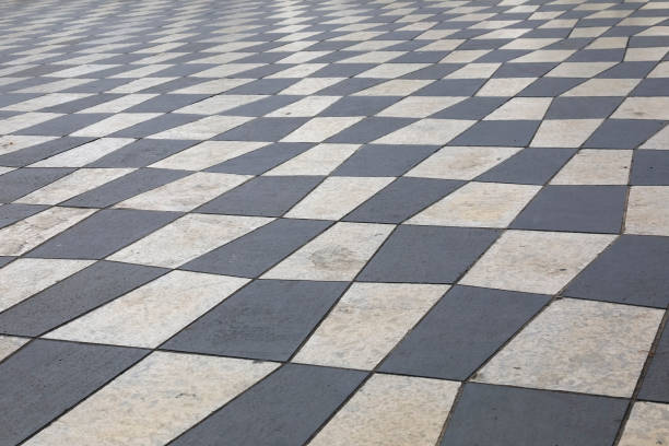 istock Sidewalk of white and black stone slabs 1356044504