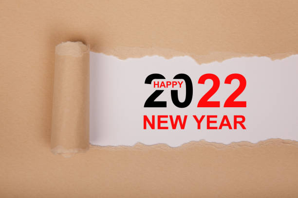istock Torn Paper With Happy New Year 2022 On White Background 1356044543