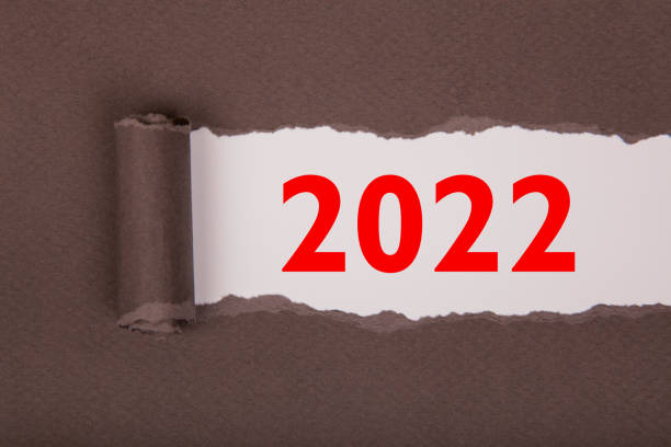 istock Torn Paper With Happy New Year 2022 On White Background 1356044736