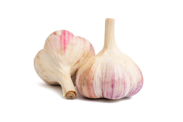 istock Fresh garlic isolated on a white background. Raw garlic on white 1356046030