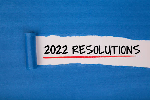 istock Torn Paper With New Year 2022 Resolutions On White Background 1356046037