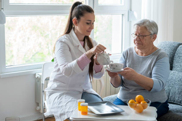 istock Caregiver at home 1356046523