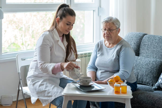 istock Caregiver at home 1356046527