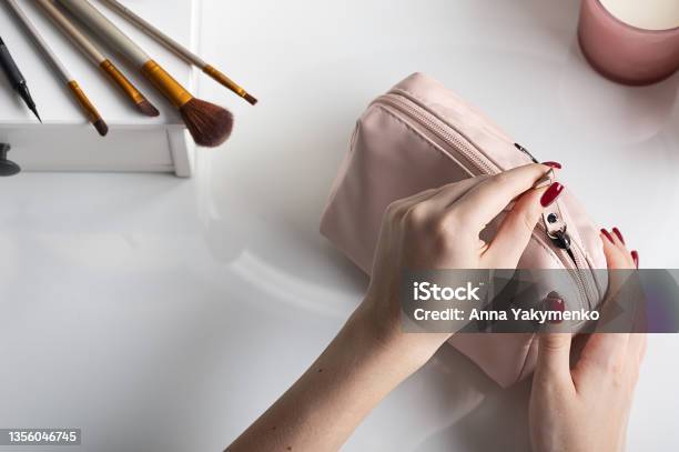 Female Hands Open Pink Cosmetic Bag For Making Makeup Concept For Storage And Handling Of Cosmetic Products Stock Photo - Download Image Now