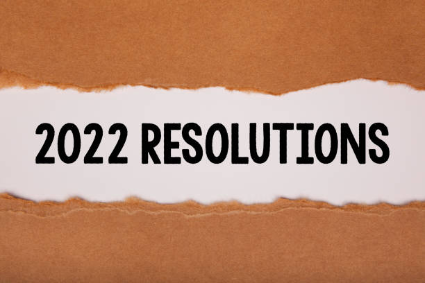 istock Torn Paper With New Year 2022 Resolutions On White Background 1356046771