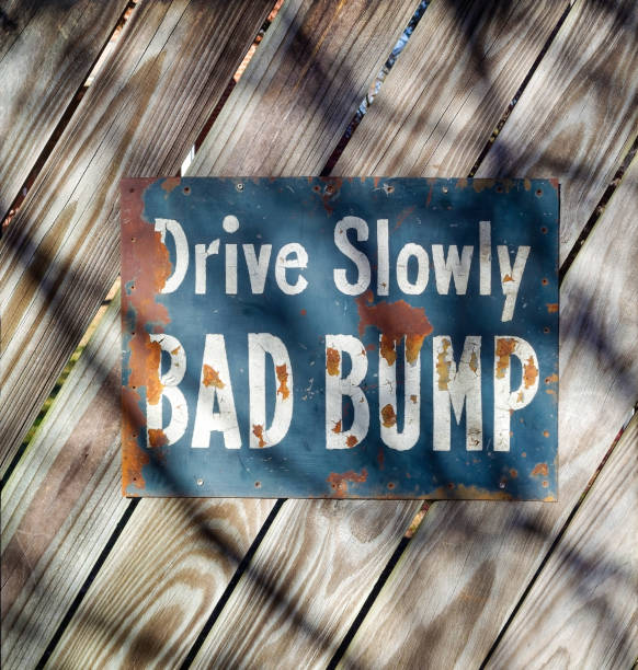 istock Vintage DRIVE SLOWLY BAD BUMP sign 1356053681