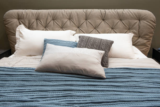istock Big comfortable bed in hotel room 1356054753