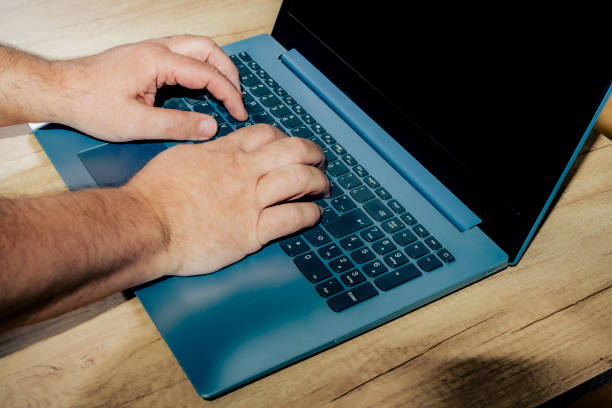 istock Hands of a man working with his laptop. Technology concept, homeoffice 1356054860