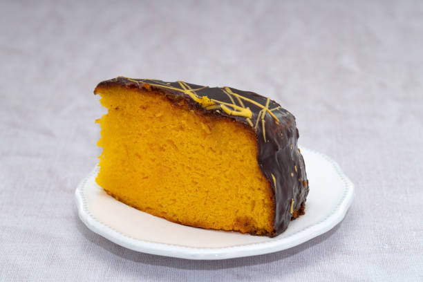 Slice of chocolate coated orange cake