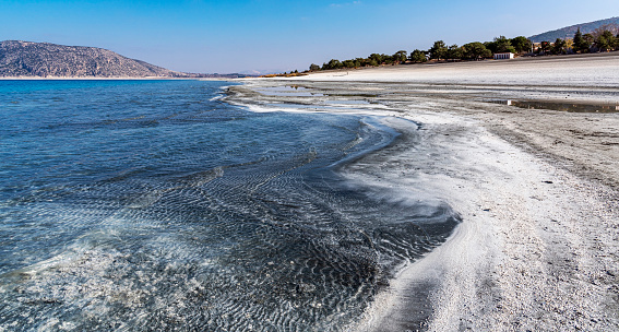 Lake Salda in Yesilova, Turkey. It is a slightly salty karst lake surrounded by forest-covered hills, rocky terrains and small alluvial plains.