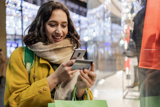 istock Happy young woman shopping during Holidays 1356067155