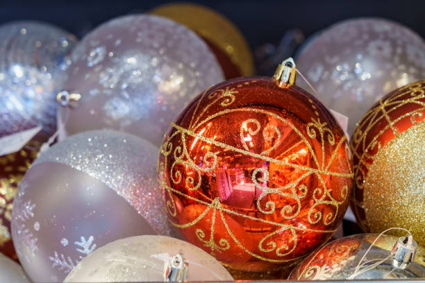 istock Red Christmas ball for a tree on a store shelf. Background with copy space for text 1356067339