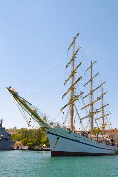 Sevastopol, Crimea, Russia - June 11, 2021: Three-masted training frigate Chersonesos. Mooring in the bay of Sevastopol.