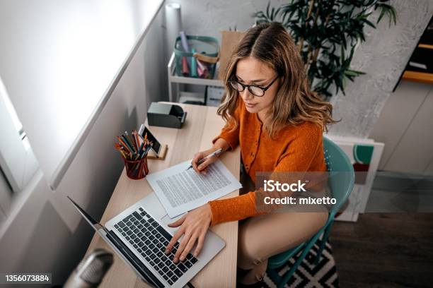 Young Woman Working On Laptop Stock Photo - Download Image Now - Letter - Document, Typing, Editor