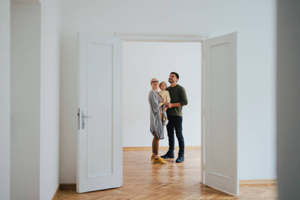 excited family moving in new home - baby carrier fotos imagens e fotografias de stock