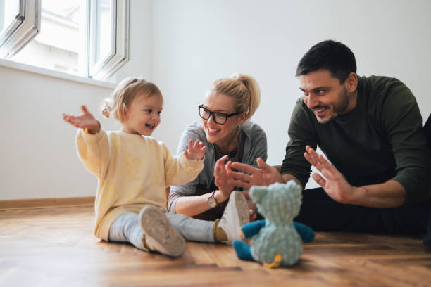 istock Happy Family Having Fun In New Home 1356074037