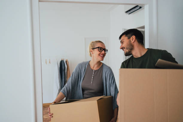 istock Loving Couple Moving In New Home 1356074091