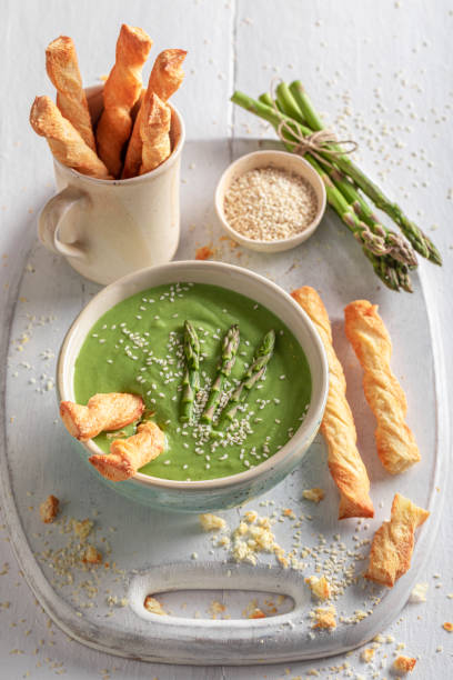 istock Green creamy asparagus soup as perfect starter in restaurant. 1356074954
