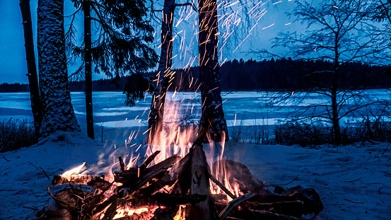 Bonfire in the winter forest. winter camping