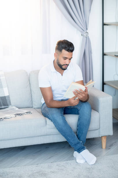 istock home reading relaxed man enjoying time arabian guy 1356078541