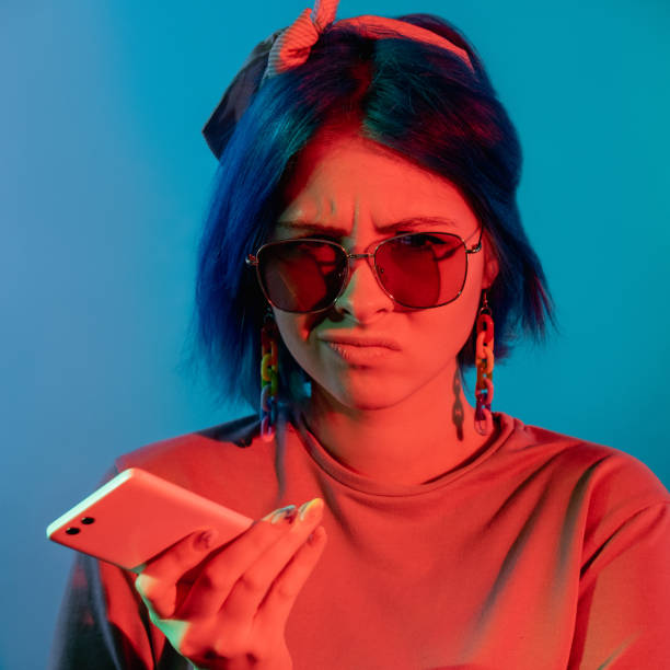 istock bad connection spam message woman phone neon light 1356078565